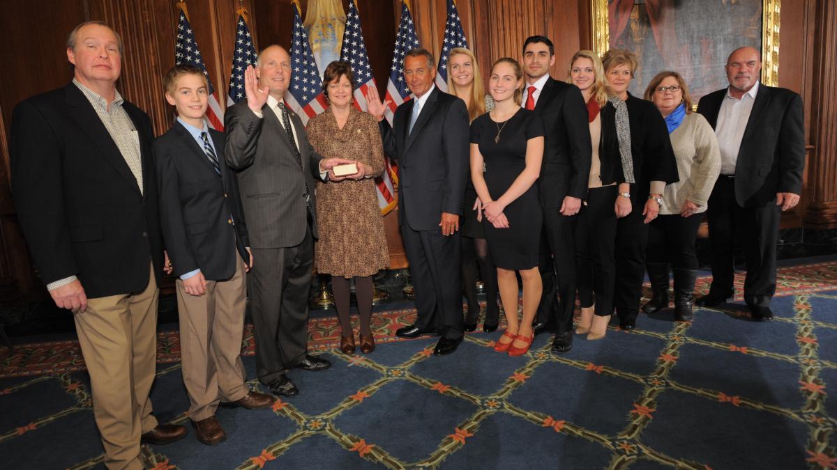 Picture of Representative Moolenaar with family and friends, taking the Oath of Office with Speaker John Boehner