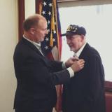 Rep. Moolenaar Presents the Purple Heart to Eugene Paulino
